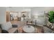 Bright and open living area with modern kitchen, wood floors, white cabinets, and stylish decor at 764 W Bayshore Dr, Tarpon Springs, FL 34689