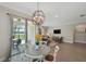 Open floor plan with dining area and living room leading to a patio with a pool view at 764 W Bayshore Dr, Tarpon Springs, FL 34689