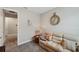 Comfortable sitting room with sofa, side table, and large clock, perfect for relaxation at 764 W Bayshore Dr, Tarpon Springs, FL 34689