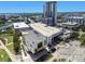 Aerial view showcases a modern museum and an upscale apartment building in a vibrant urban setting at 777 N Ashley Dr # 3009, Tampa, FL 33602