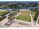 Expansive aerial view of a waterfront park and cityscape, complete with walking paths and lush landscaping at 777 N Ashley Dr # 3009, Tampa, FL 33602