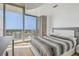 Modern bedroom with large windows showcasing stunning city skyline at 777 N Ashley Dr # 3009, Tampa, FL 33602