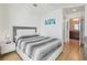 Cozy bedroom with hardwood floors and access to a bathroom at 777 N Ashley Dr # 3009, Tampa, FL 33602