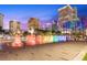 Nighttime cityscape with vibrant fountain display, showcasing the area's public art and urban allure at 777 N Ashley Dr # 3009, Tampa, FL 33602