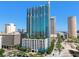 Modern high-rise condo building featuring a sleek glass facade, private balconies, and stunning architectural design at 777 N Ashley Dr # 3009, Tampa, FL 33602