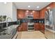 Modern kitchen with stainless steel appliances and dark backsplash at 777 N Ashley Dr # 3009, Tampa, FL 33602