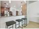 Kitchen featuring a granite countertop with three stools at 777 N Ashley Dr # 3009, Tampa, FL 33602