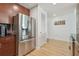 Stainless steel refrigerator next to a louvered door at 777 N Ashley Dr # 3009, Tampa, FL 33602