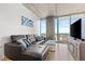 Comfortable living room with gray sectional, city view, and stylish furniture at 777 N Ashley Dr # 3009, Tampa, FL 33602