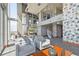 Stylish lounge area with modern seating, a spiral staircase, and large windows offering abundant natural light at 777 N Ashley Dr # 3009, Tampa, FL 33602