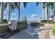 Outdoor grilling and dining area overlooking the cityscape with palm trees and a covered area at 777 N Ashley Dr # 3009, Tampa, FL 33602