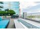 Outdoor fire pit area with sofa seating and views of the cityscape in the distance at 777 N Ashley Dr # 3009, Tampa, FL 33602