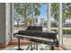 Elegant grand piano positioned near large windows, offering views of the city and creating a refined ambiance at 777 N Ashley Dr # 3009, Tampa, FL 33602