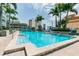 Beautiful pool area surrounded by tropical landscaping and city views at 777 N Ashley Dr # 3009, Tampa, FL 33602