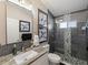 Stylish bathroom with a modern shower, vanity, and decorative art at 8508 Canterbury Lake Blvd, Tampa, FL 33619
