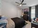Bedroom with a large bed, dark accents, and a ceiling fan at 8508 Canterbury Lake Blvd, Tampa, FL 33619