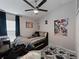 Bedroom with large bed, natural light, and ceiling fan at 8508 Canterbury Lake Blvd, Tampa, FL 33619