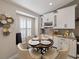 Inviting breakfast nook featuring natural light, built-in cabinets, and a view of the kitchen at 8508 Canterbury Lake Blvd, Tampa, FL 33619