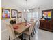 Formal dining room featuring a modern chandelier and stylish decor, perfect for entertaining at 8508 Canterbury Lake Blvd, Tampa, FL 33619