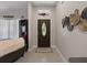 Inviting home foyer featuring a decorative front door with transom window at 8508 Canterbury Lake Blvd, Tampa, FL 33619