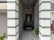 Home entrance featuring a decorative tiled walkway and front door at 8508 Canterbury Lake Blvd, Tampa, FL 33619