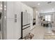 Spacious kitchen featuring white cabinets, modern appliances, and an adjacent dining area for convenience at 8508 Canterbury Lake Blvd, Tampa, FL 33619
