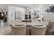 Stylish kitchen with granite island, pendant lighting, and a view into the dining area at 8508 Canterbury Lake Blvd, Tampa, FL 33619