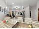 Open-concept kitchen with stone countertops, pendant lights, and views of the adjacent living area at 8508 Canterbury Lake Blvd, Tampa, FL 33619