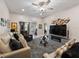 Cozy living room featuring plush seating, modern decor, and a view of the outdoor area at 8508 Canterbury Lake Blvd, Tampa, FL 33619