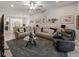Spacious living room with a modern design, plush seating, and an open connection to the kitchen at 8508 Canterbury Lake Blvd, Tampa, FL 33619