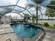 Enclosed pool with lakeside views and landscaping at 8508 Canterbury Lake Blvd, Tampa, FL 33619