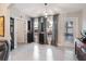 Relaxing sun room with a view of the lake, light flooring, and neutral paint at 8508 Canterbury Lake Blvd, Tampa, FL 33619