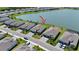 Beautiful home from an aerial view with a private fenced yard with views of the lake at 8589 Saint Kitts Cir, Englewood, FL 34224