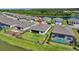 Beautiful backyard with a fenced yard and pool, offering privacy and water views in a planned community at 8589 Saint Kitts Cir, Englewood, FL 34224