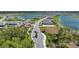 Beautiful aerial view of the community showcasing the winding roads, mature trees, and two large lakes at 8589 Saint Kitts Cir, Englewood, FL 34224