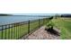 Fenced backyard offers serene water views and landscaping for privacy and outdoor enjoyment at 8589 Saint Kitts Cir, Englewood, FL 34224