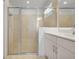Shower with a full glass door in an updated bathroom at 8589 Saint Kitts Cir, Englewood, FL 34224