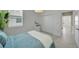 Comfortable bedroom featuring a large window for natural light and a closet at 8589 Saint Kitts Cir, Englewood, FL 34224