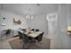 Open dining area featuring neutral walls, tiled floors, and modern furnishings at 8589 Saint Kitts Cir, Englewood, FL 34224