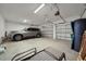 Spacious two-car garage with overhead storage and room for a SUV at 8589 Saint Kitts Cir, Englewood, FL 34224