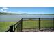 Scenic lake view from the backyard, highlighting the property's serene waterfront location at 8589 Saint Kitts Cir, Englewood, FL 34224