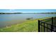 Picturesque lake view from the property showcasing the tranquil waterfront setting and surrounding landscape at 8589 Saint Kitts Cir, Englewood, FL 34224