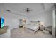 Bright main bedroom with tile floors, tray ceiling, and a large window for ample natural light at 8589 Saint Kitts Cir, Englewood, FL 34224