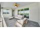 Relaxing covered patio featuring comfortable seating and serene views of the surrounding greenery at 8589 Saint Kitts Cir, Englewood, FL 34224