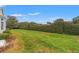 Manicured backyard featuring a large hedge at 9188 Rhett Ln, Weeki Wachee, FL 34613