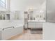 Bathroom features a soaking tub, separate shower, and vanity sinks at 9188 Rhett Ln, Weeki Wachee, FL 34613