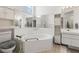 Large bathroom featuring a soaking tub, and separate vanity sinks at 9188 Rhett Ln, Weeki Wachee, FL 34613