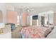 Spacious bedroom features a ceiling fan, closet, and access to a balcony at 9188 Rhett Ln, Weeki Wachee, FL 34613