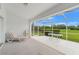 Screened lanai offering peaceful views of lawn and shrubbery at 9188 Rhett Ln, Weeki Wachee, FL 34613