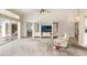 Bright living room with sliding glass doors to the patio and a seamless transition to the kitchen at 9188 Rhett Ln, Weeki Wachee, FL 34613